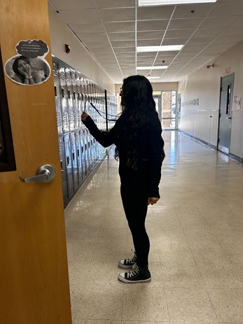 Eighth grader Jamila
Corpus shows her ID to her
teacher, which is one of the security
measures being readily enforced after the Uvalde incident.